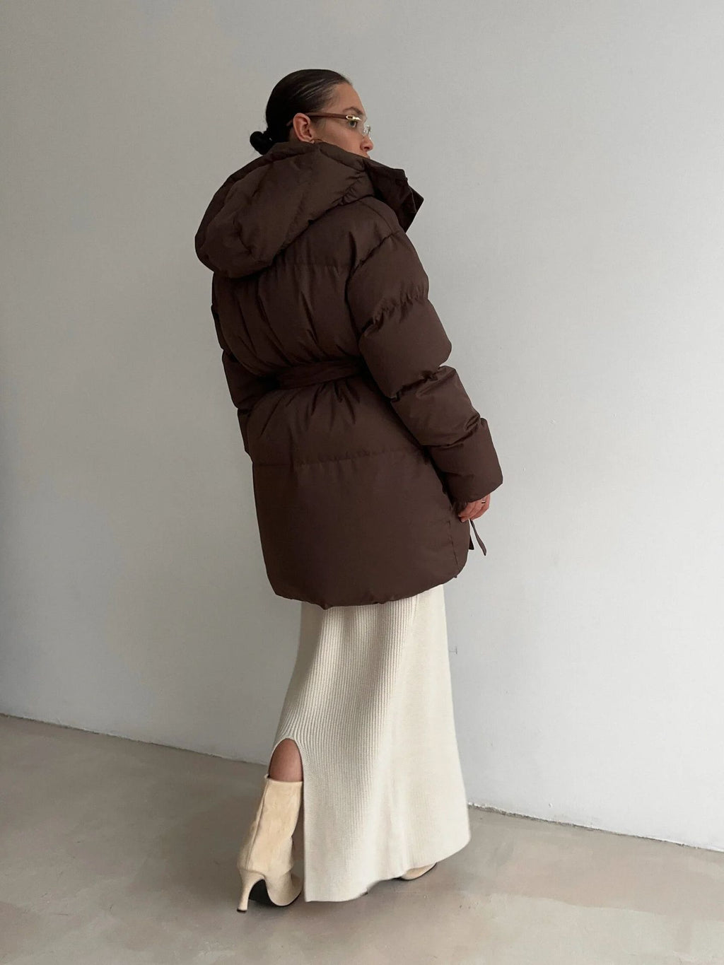 Belted Hooded Puffer Jacket with Zip Front in Espresso Brown — back three-quarter view on model