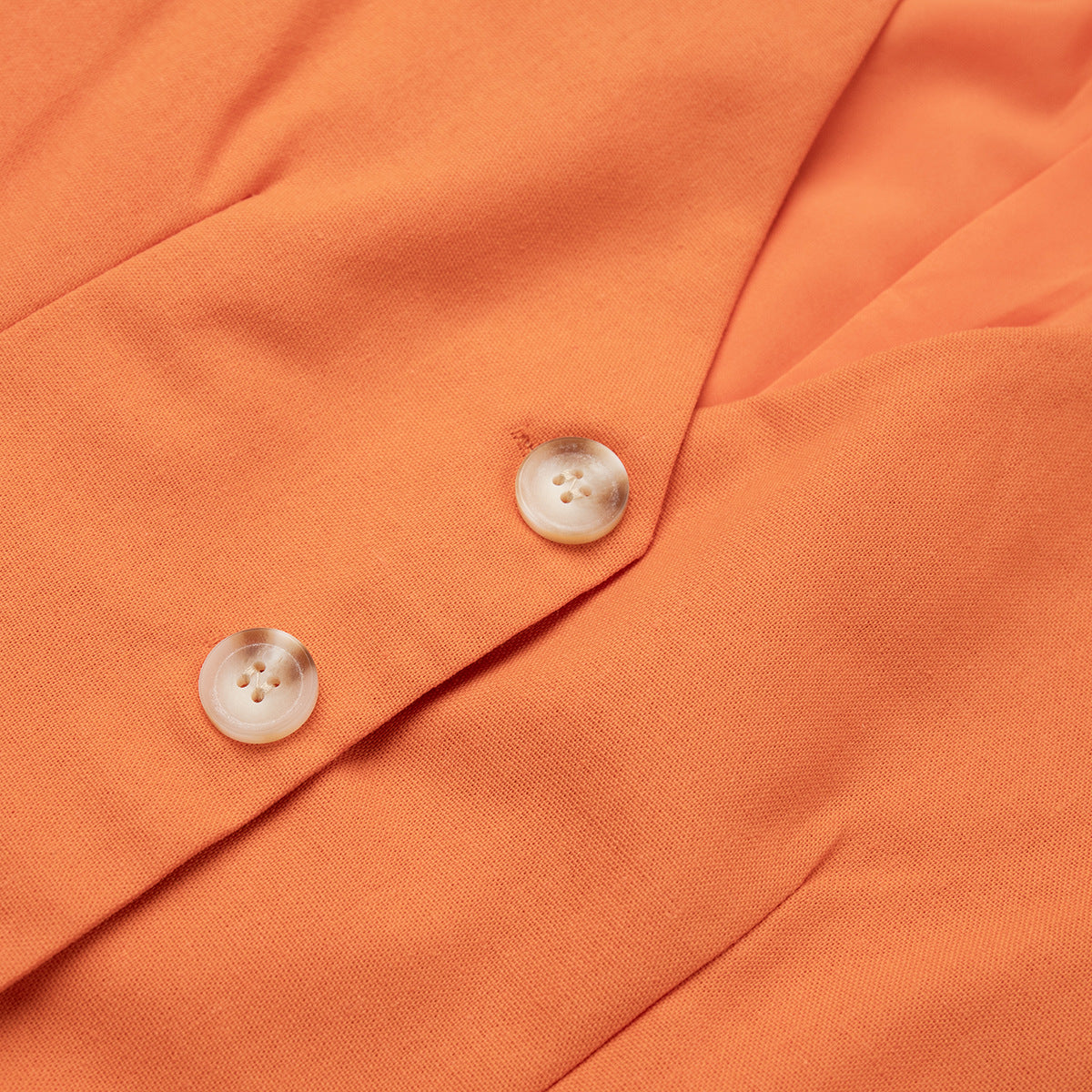 Linen Vest & Maxi Skirt Set in Orange — close-up of vest hem and buttons