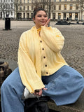 Oversized Wide-Rib Crew Neck Button Cardigan in Butter Yellow — front view on model
