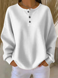 Waffle-Knit Henley Long-Sleeve Top in White — front view on model