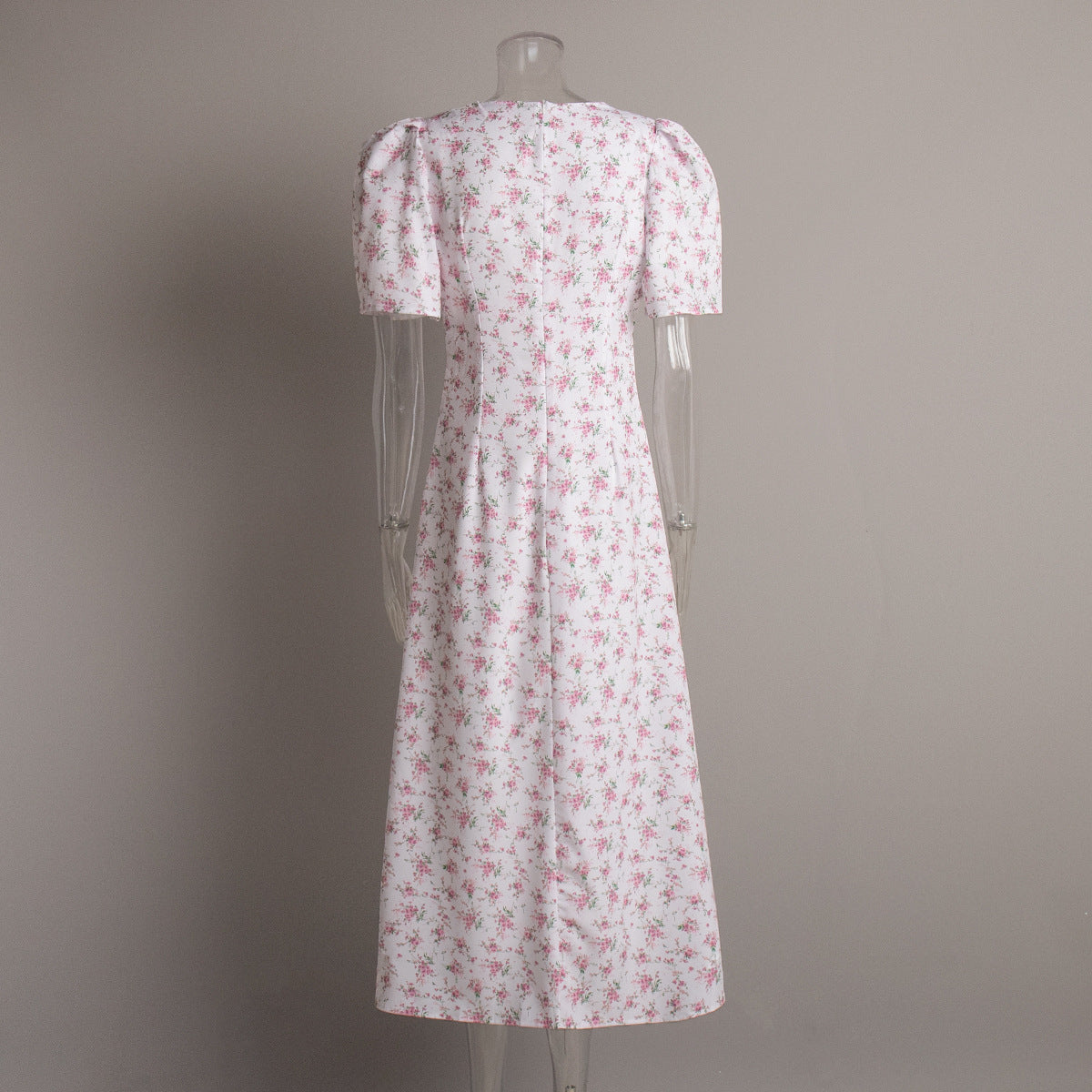 Floral Puff-Sleeve V-Neck Maxi Dress in White Floral — back view on mannequin