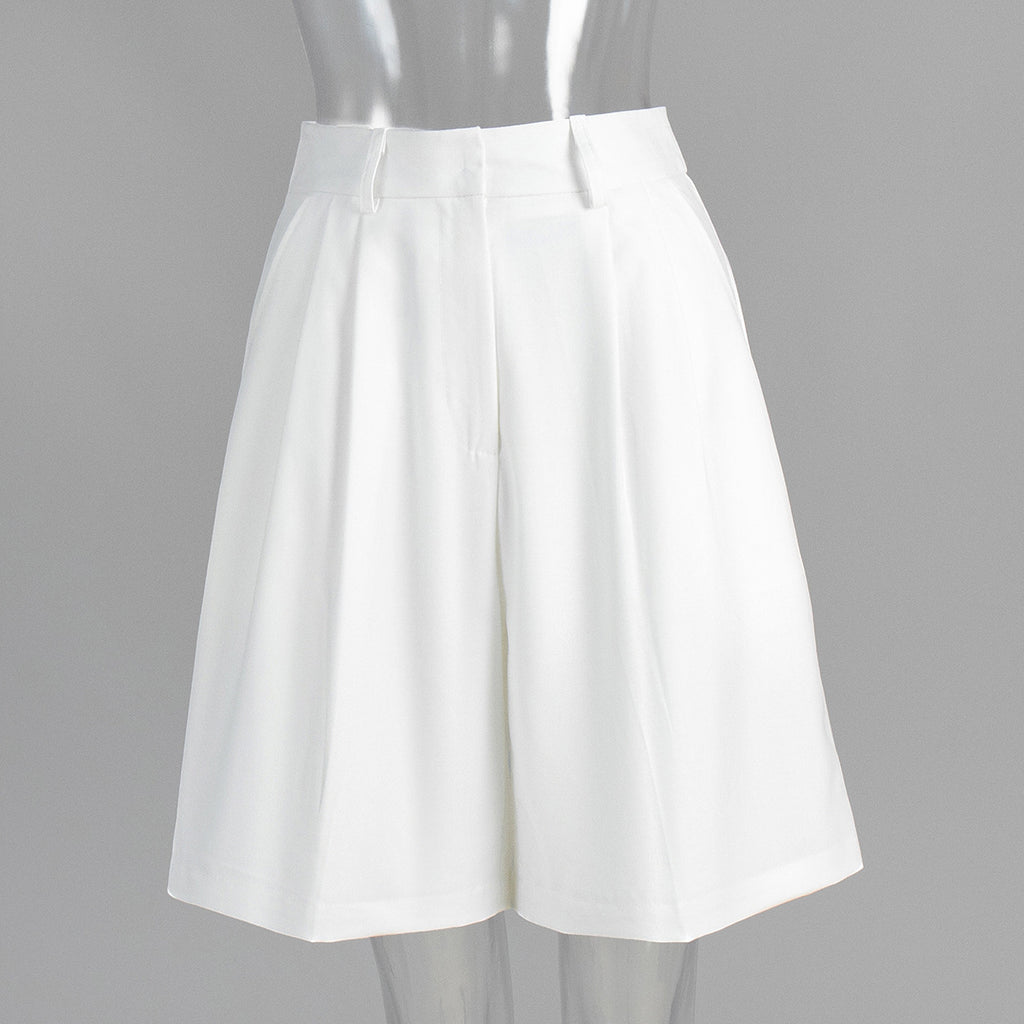 High-Waist Pleated Bermuda Shorts in White — front view on mannequin