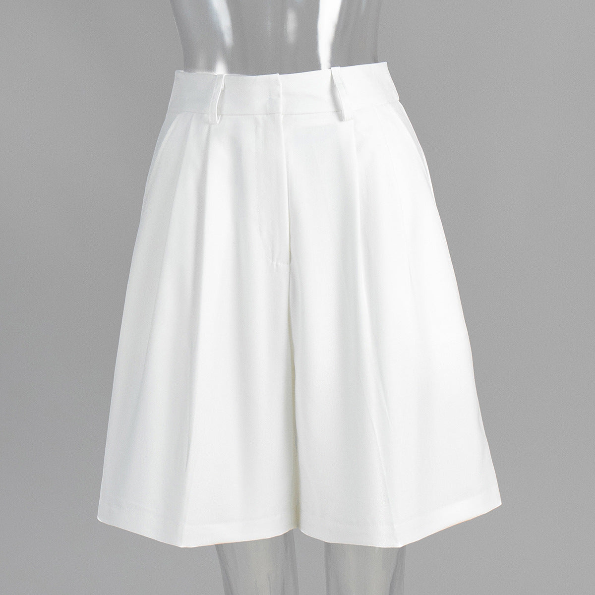 High-Waist Pleated Bermuda Shorts in White — front view on mannequin