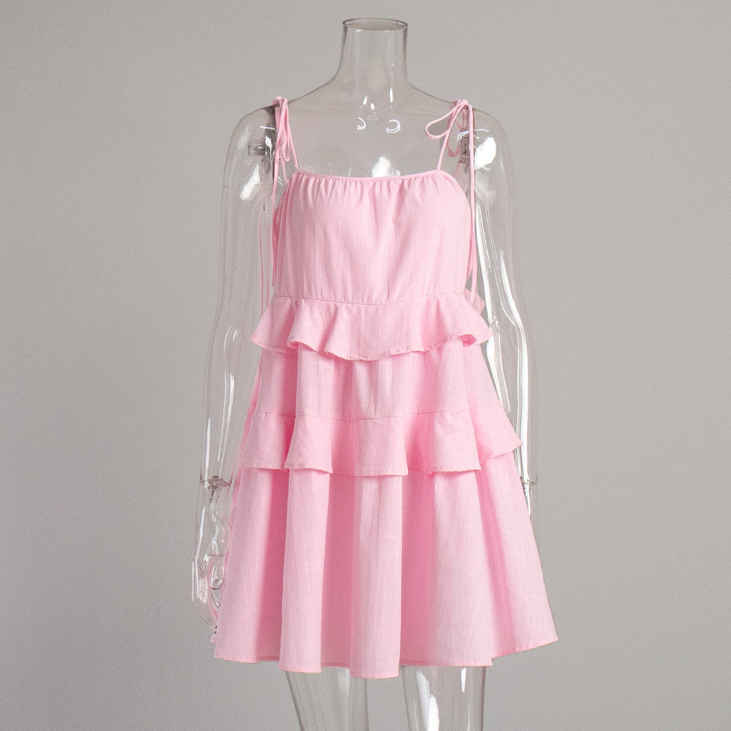Tiered Ruffle Tie-Strap Mini Dress in Soft Pink — front view on mannequin