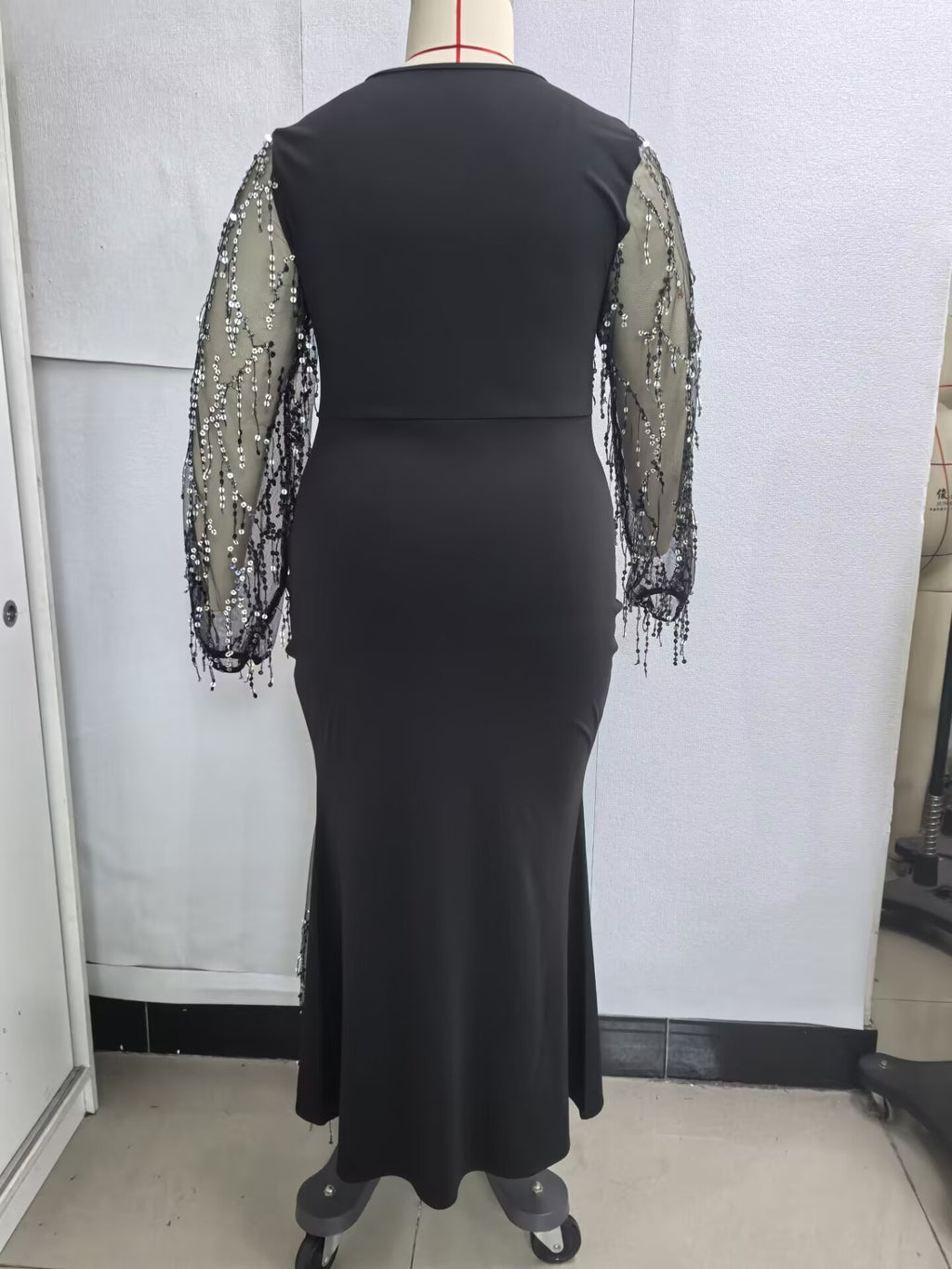 Plus-Size Mermaid Maxi Gown with Sequin-Fringe Mesh Sleeves in Black — back view on mannequin