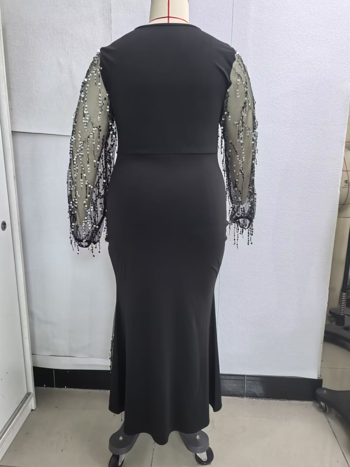 Plus-Size Mermaid Maxi Gown with Sequin-Fringe Mesh Sleeves in Black — back view on mannequin