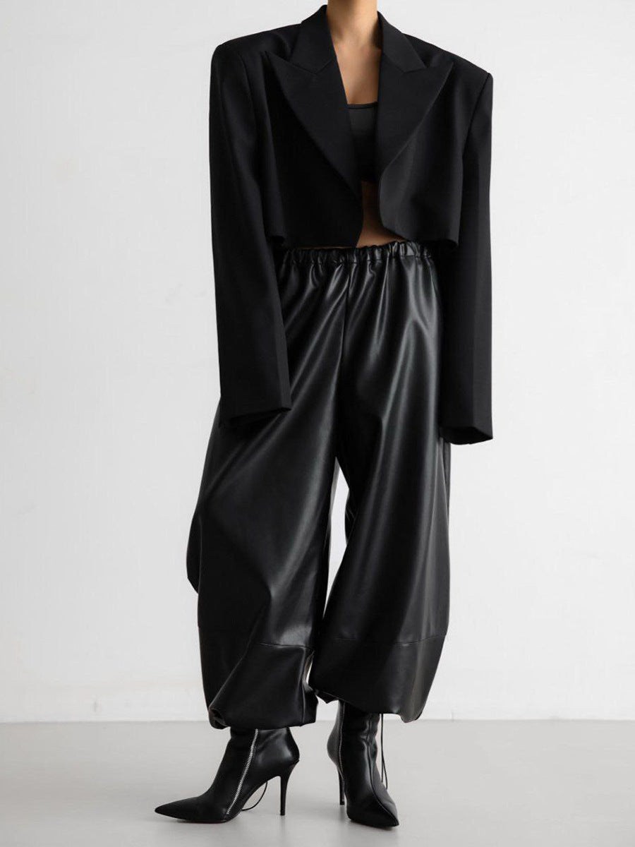 Faux Leather Balloon Pants with Drawstring Ankles in Black — on model with a cropped blazer