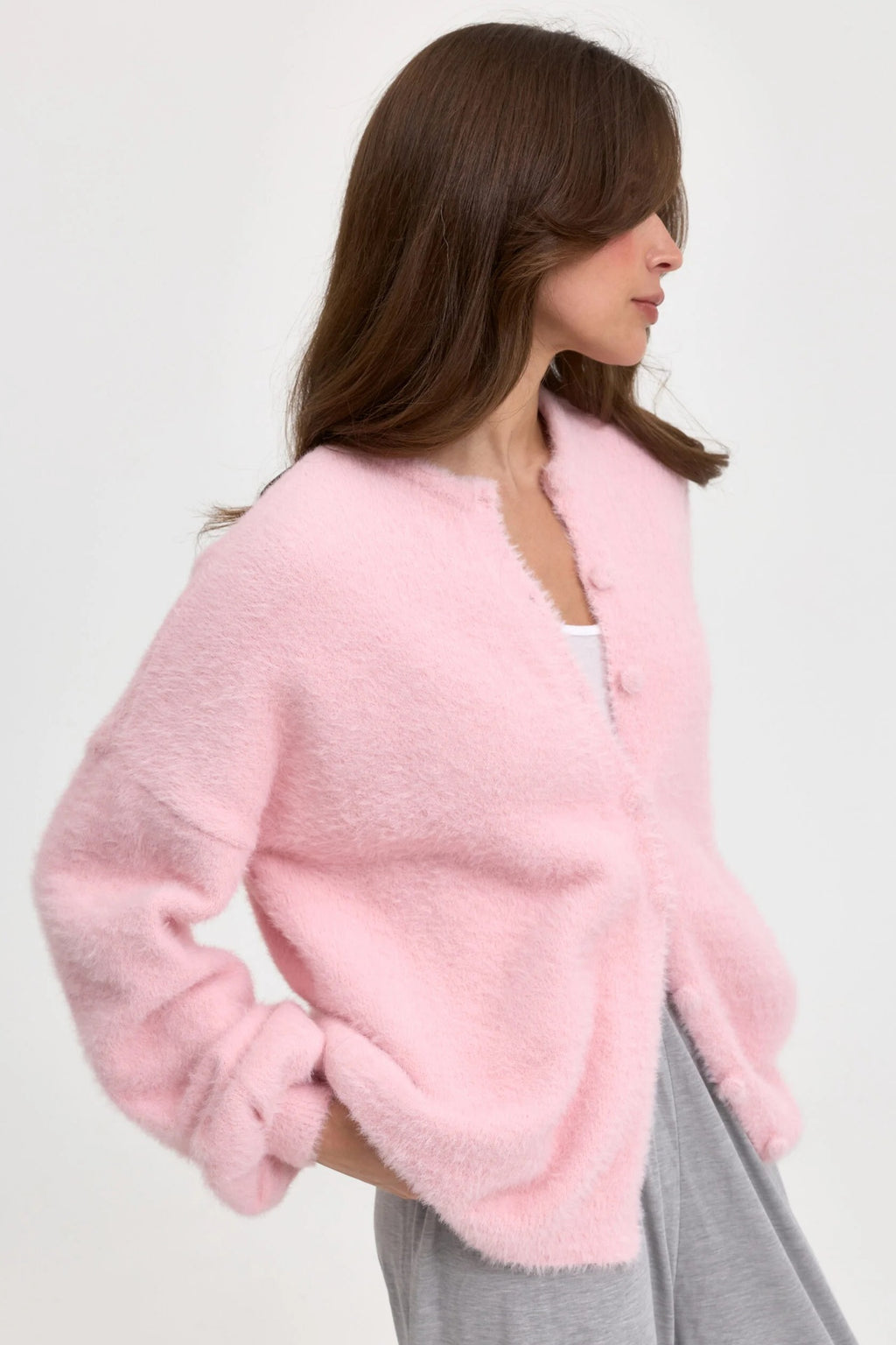 Fuzzy Round Neck Button Cardigan in Pink — side view on model