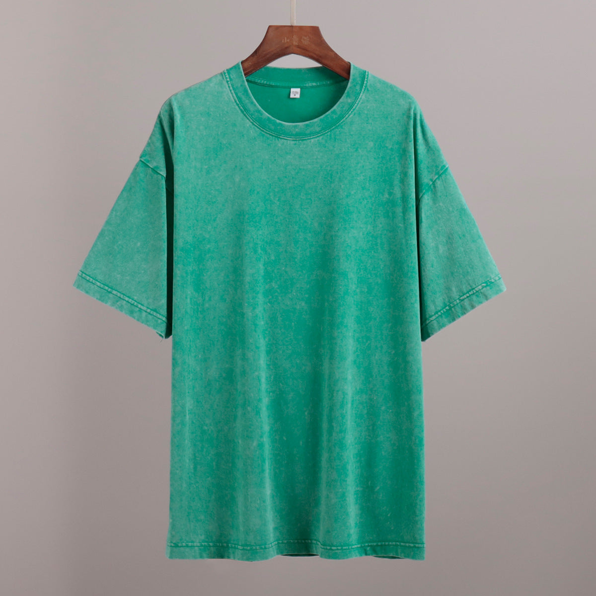 Oversized Washed Cotton Crewneck Tee in Grass Green — on hanger