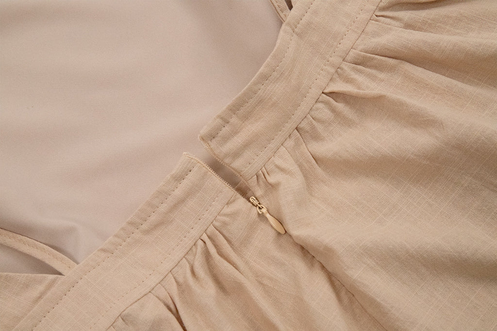 Tie-Shoulder Open-Back Cotton Maxi Dress in Apricot — close-up of the gathered waist seam
