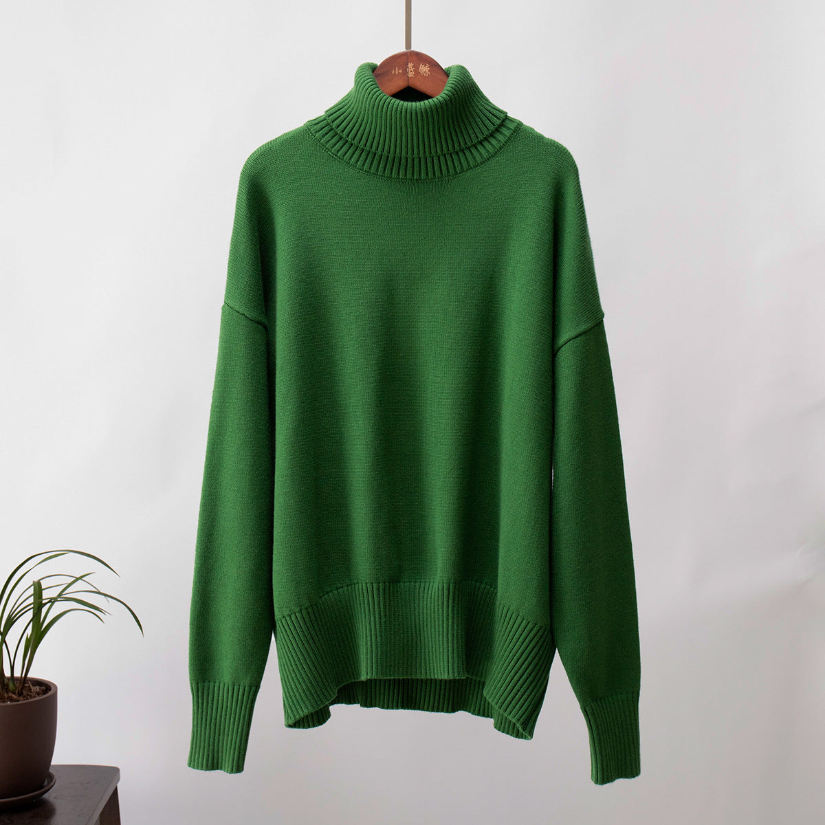 Oversized Knit Turtleneck Sweater in Forest Green — front view