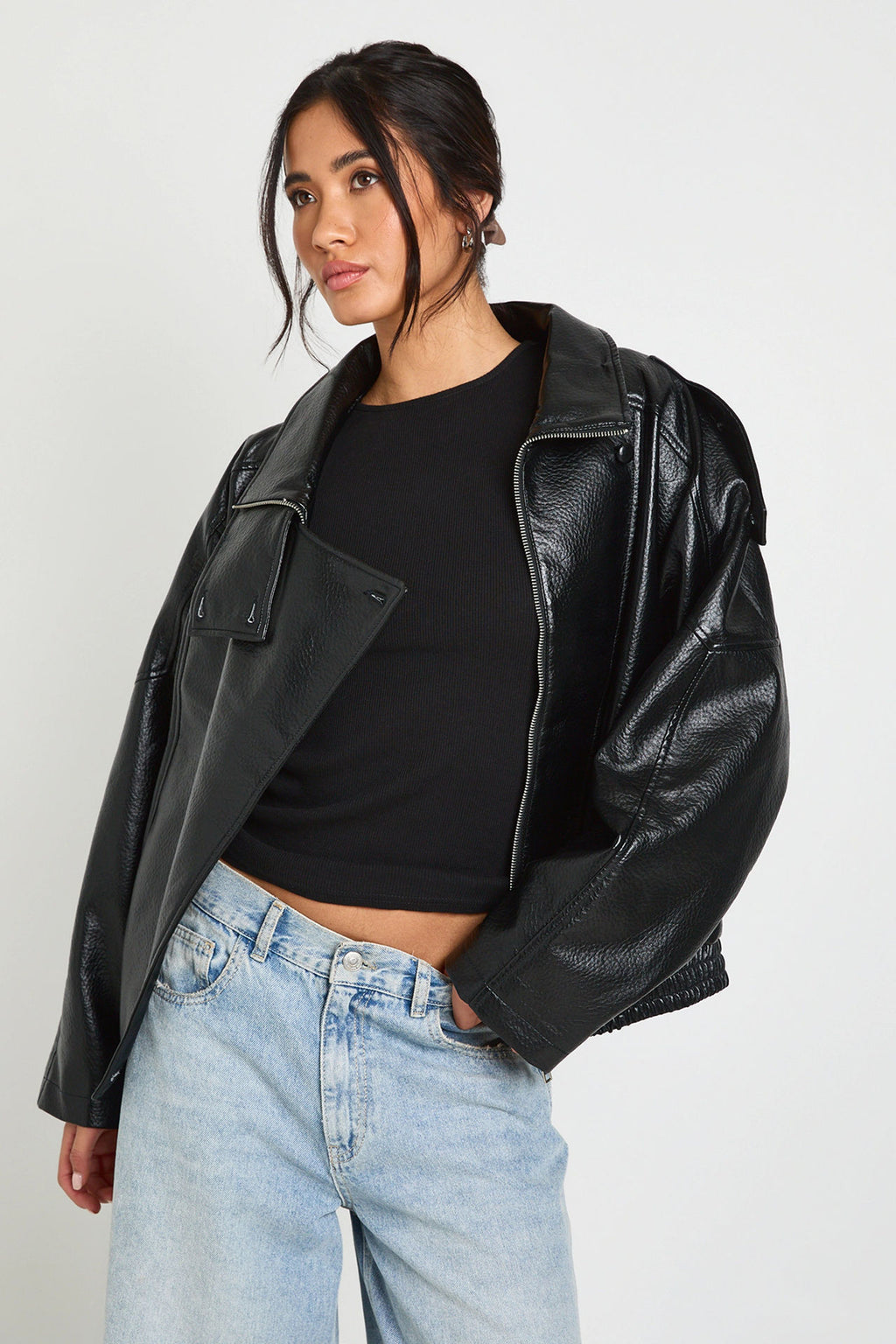 Oversized Stand-Collar Faux Leather Jacket in Black — on model