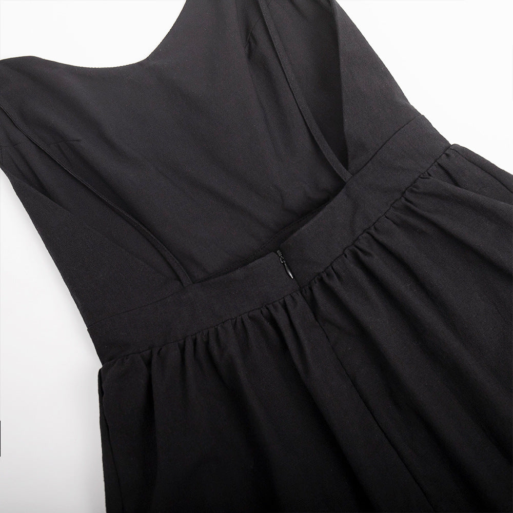 Tie-Shoulder Open-Back Cotton Mini Dress in Black — close-up of skirt gather