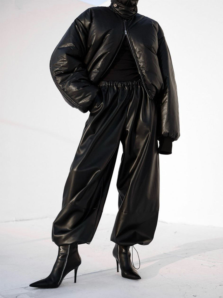 Faux Leather Balloon Pants with Drawstring Ankles in Black — full length on model with a puffer jacket