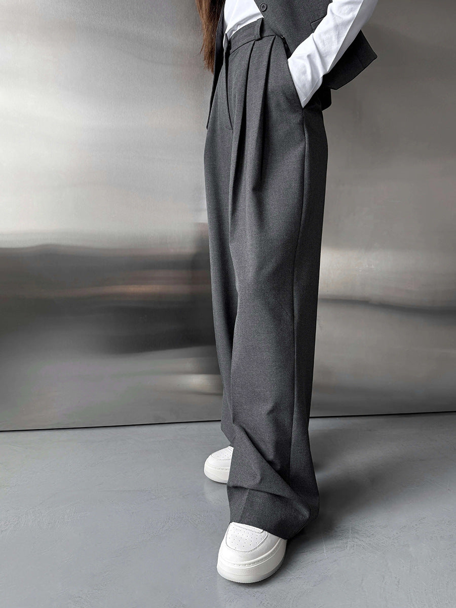 Pleated Wide-Leg Trousers in Charcoal Gray — on model, full length
