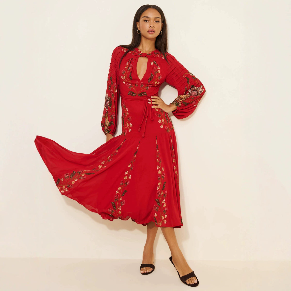Floral Print Keyhole Midi Dress with Balloon Sleeves in Red — on model, showing the flared skirt in motion