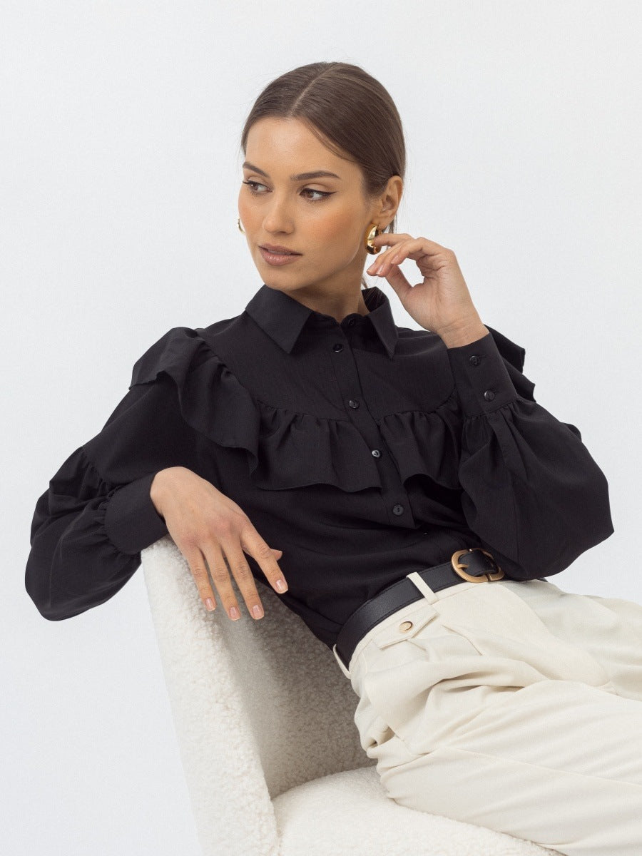 Cotton Ruffle Collar Button-Down Blouse in Black — seated close-up of collar and ruffle