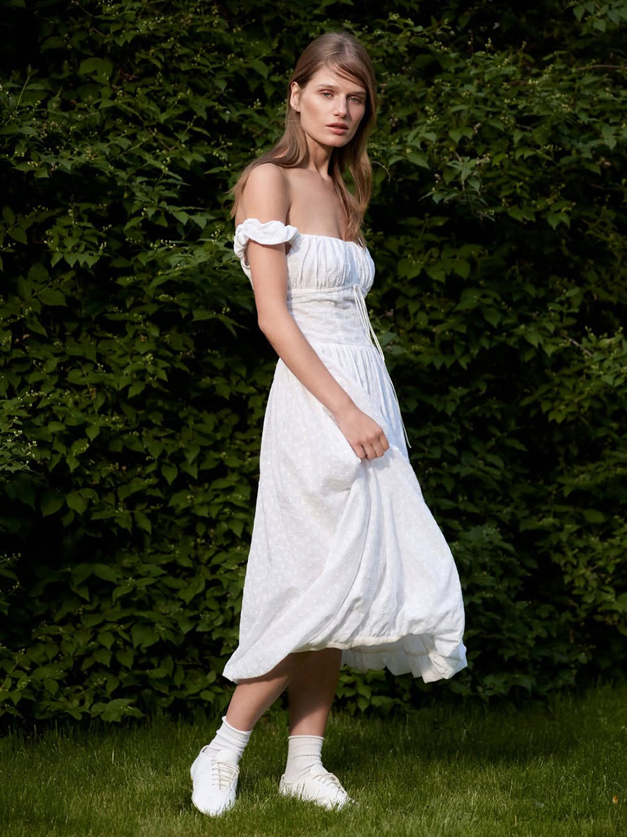 Eyelet Cotton Off-Shoulder Midi Dress in Ivory Eyelet — side view on model, studio