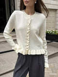 Ruffle-Trim Button-Front Knit Cardigan in Ivory — front view on model
