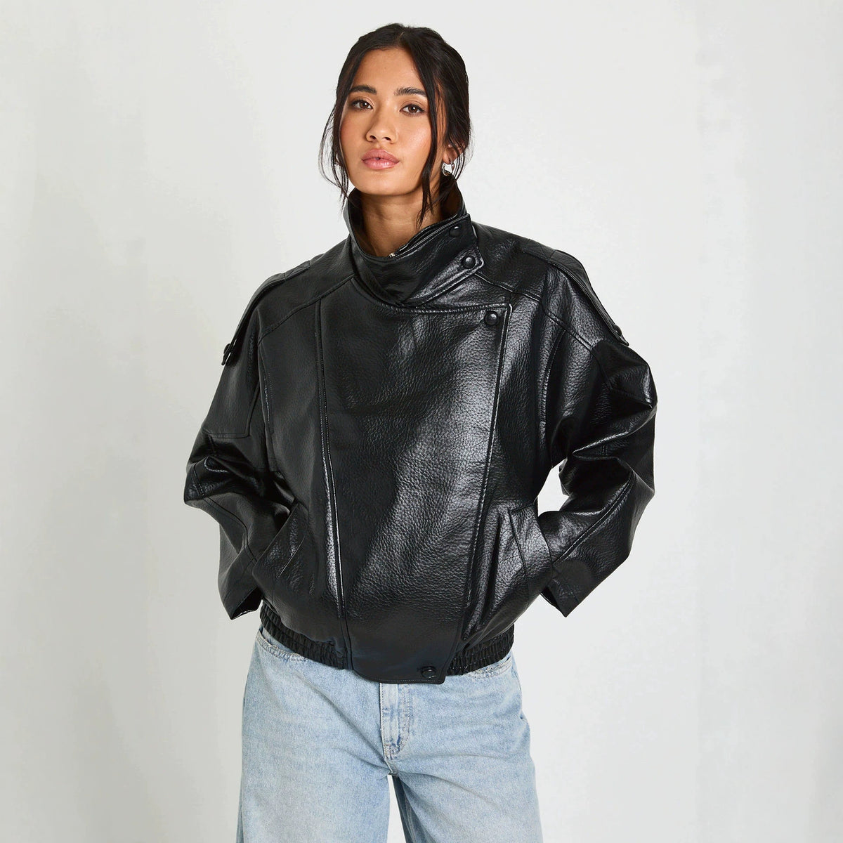 Oversized Stand-Collar Faux Leather Jacket in Black — front view on model