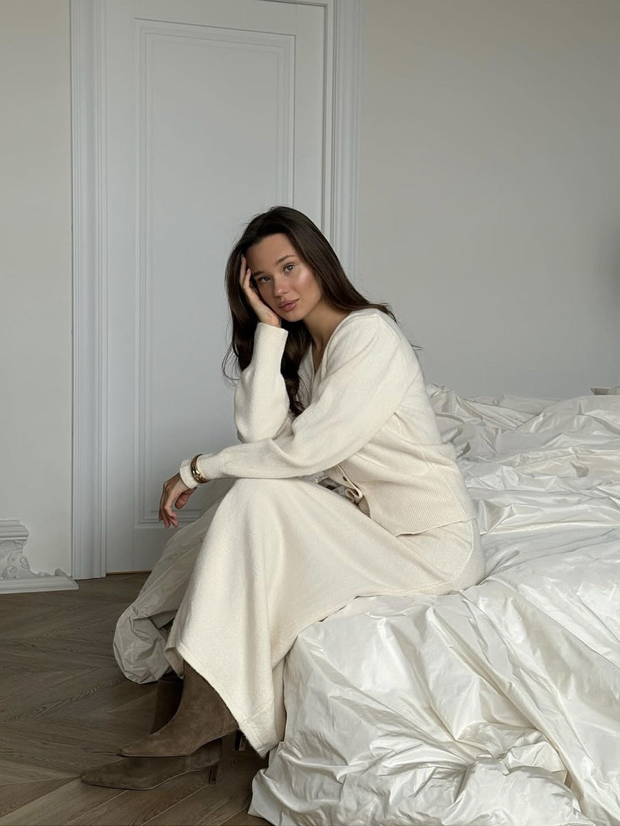 V-Neck Button Cardigan & Knit Midi Skirt Set in Ivory — seated view on model