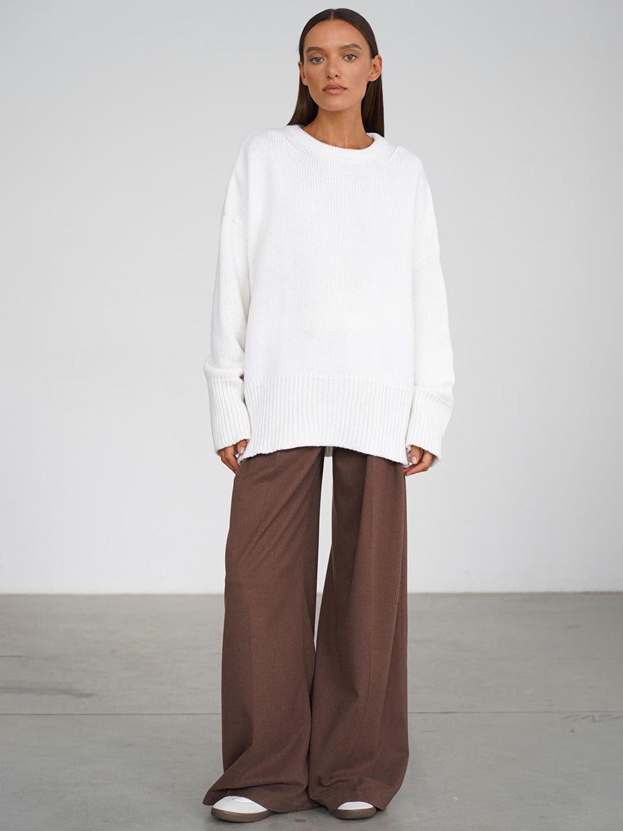 Slouchy Oversized Crew Neck Sweater in Ivory — front view on model with brown trousers