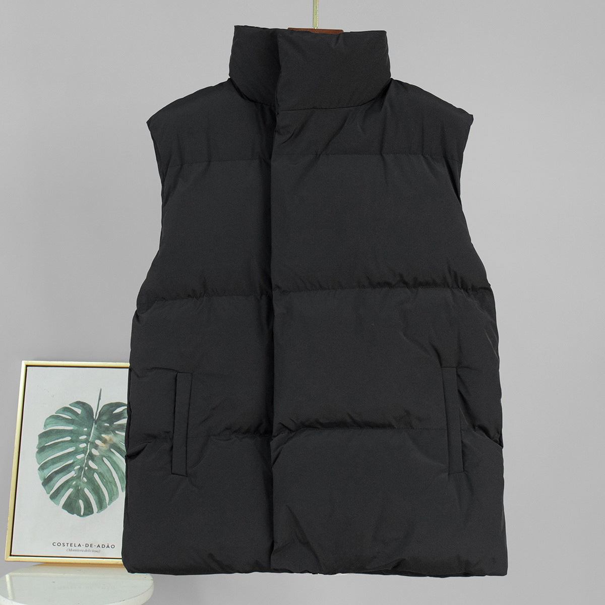Longline Puffer Vest with High Stand Collar in Black — front view