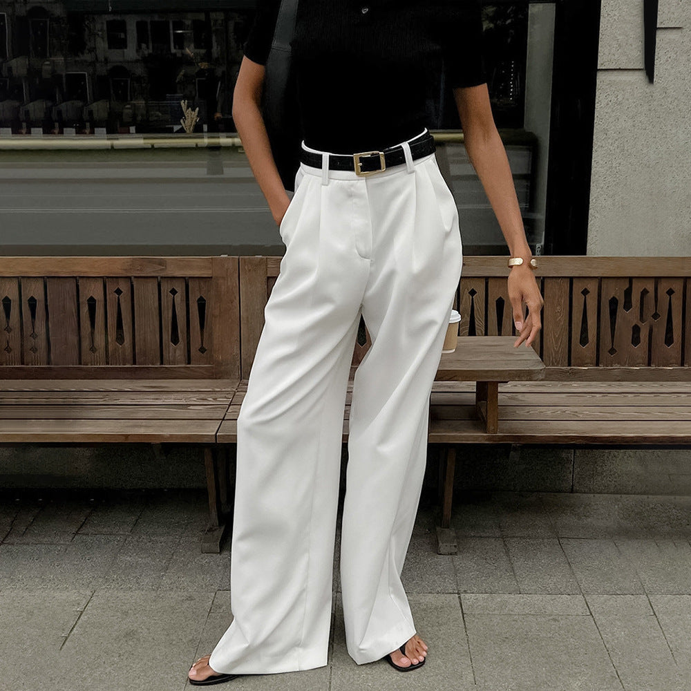 High-Waist Pleated Wide-Leg Trousers in White — front view on model, full length