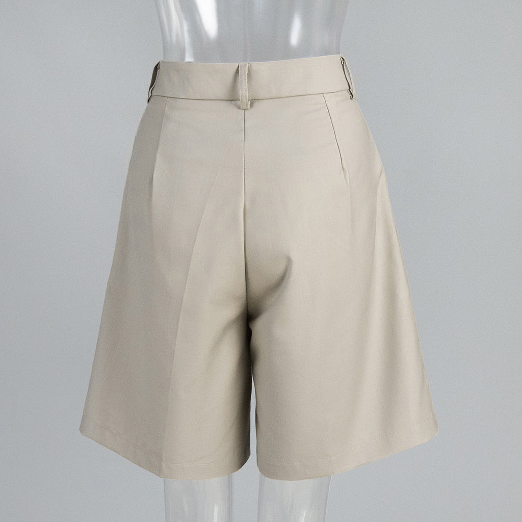 High-Waist Pleated Bermuda Shorts in Apricot — back view on mannequin