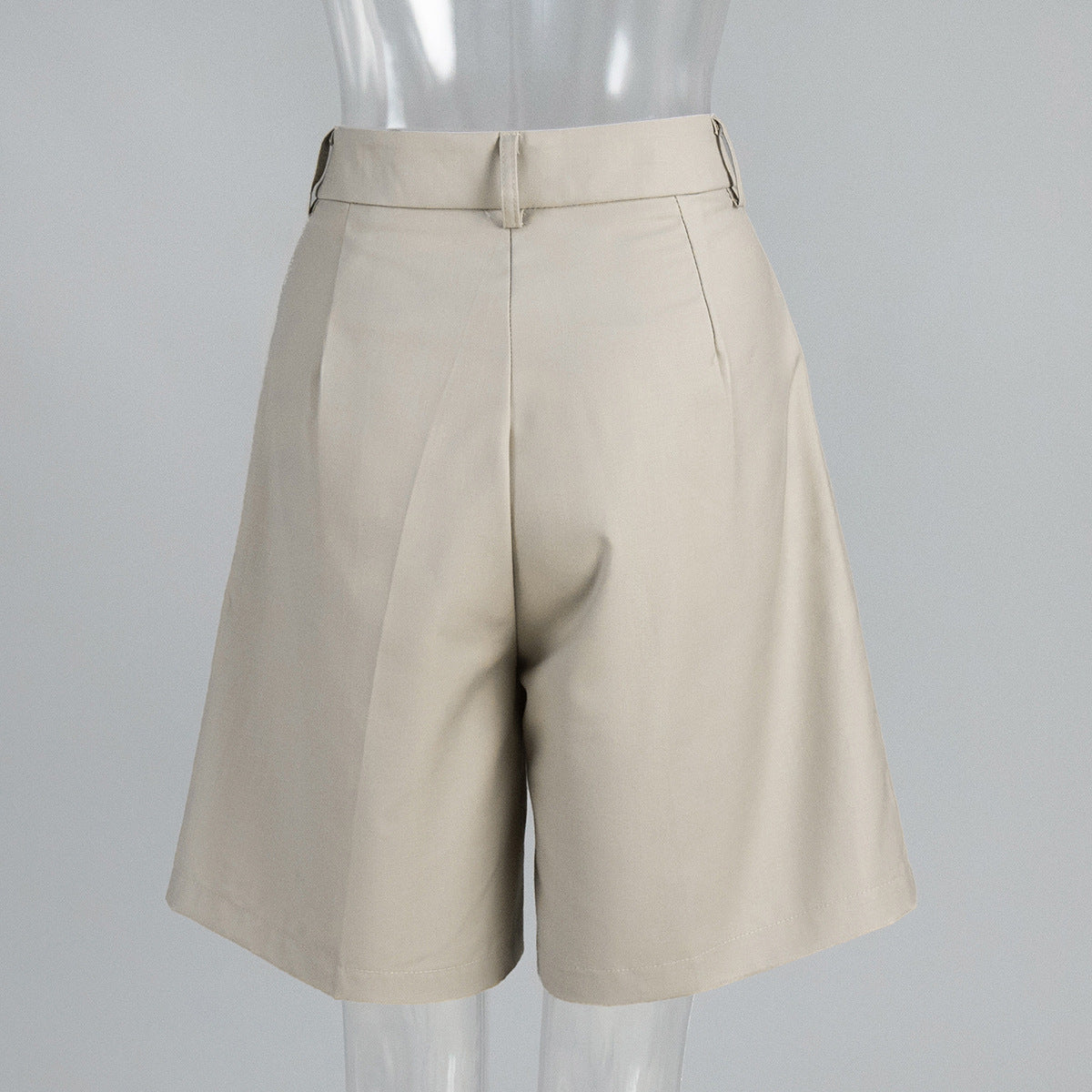 High-Waist Pleated Bermuda Shorts in Apricot — back view on mannequin