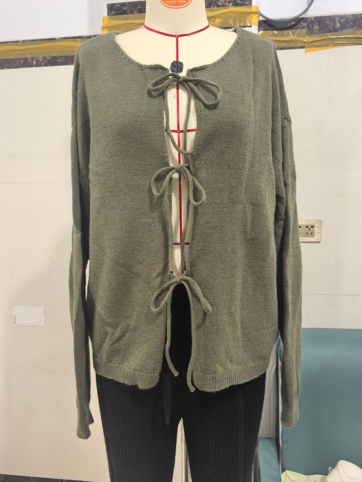 Round Neck Tie-Front Knit Cardigan in Olive — front view on mannequin