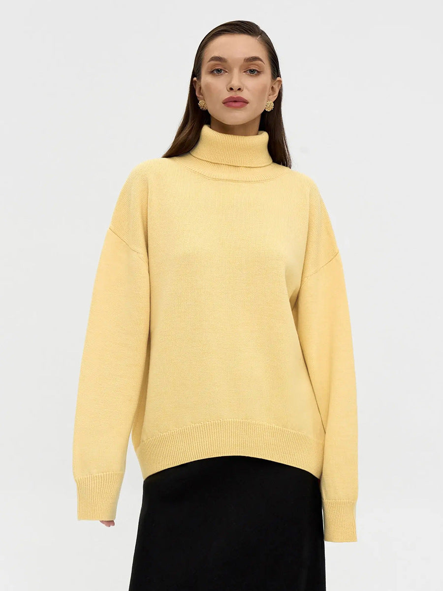 Oversized Knit Turtleneck Sweater in Butter Yellow — front view on model