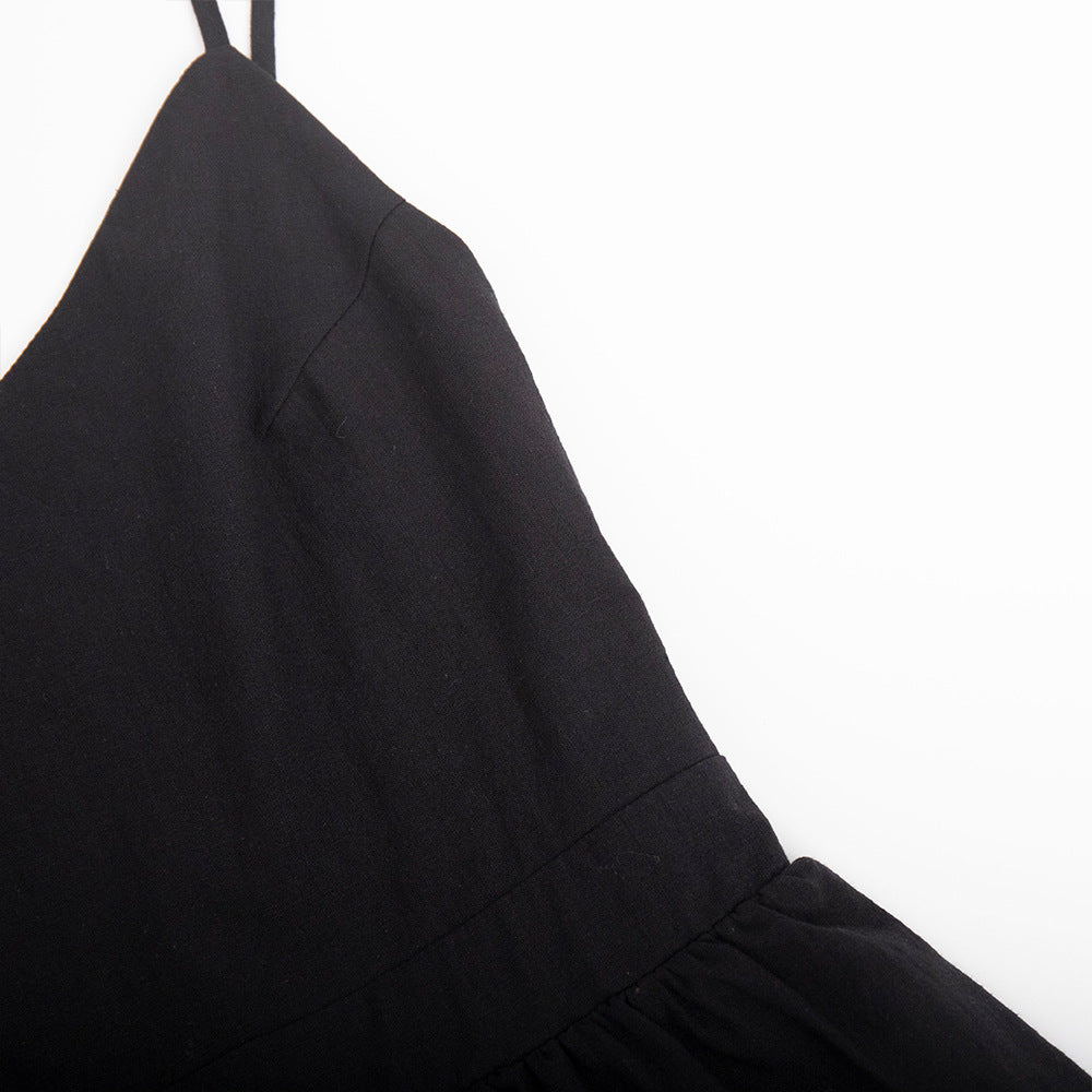Tie-Shoulder Open-Back Cotton Mini Dress in Black — close-up of waist seam