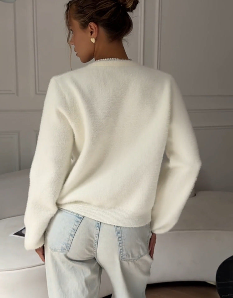 Soft Bow-Embellished V-Neck Cardigan in Ivory — back view on model