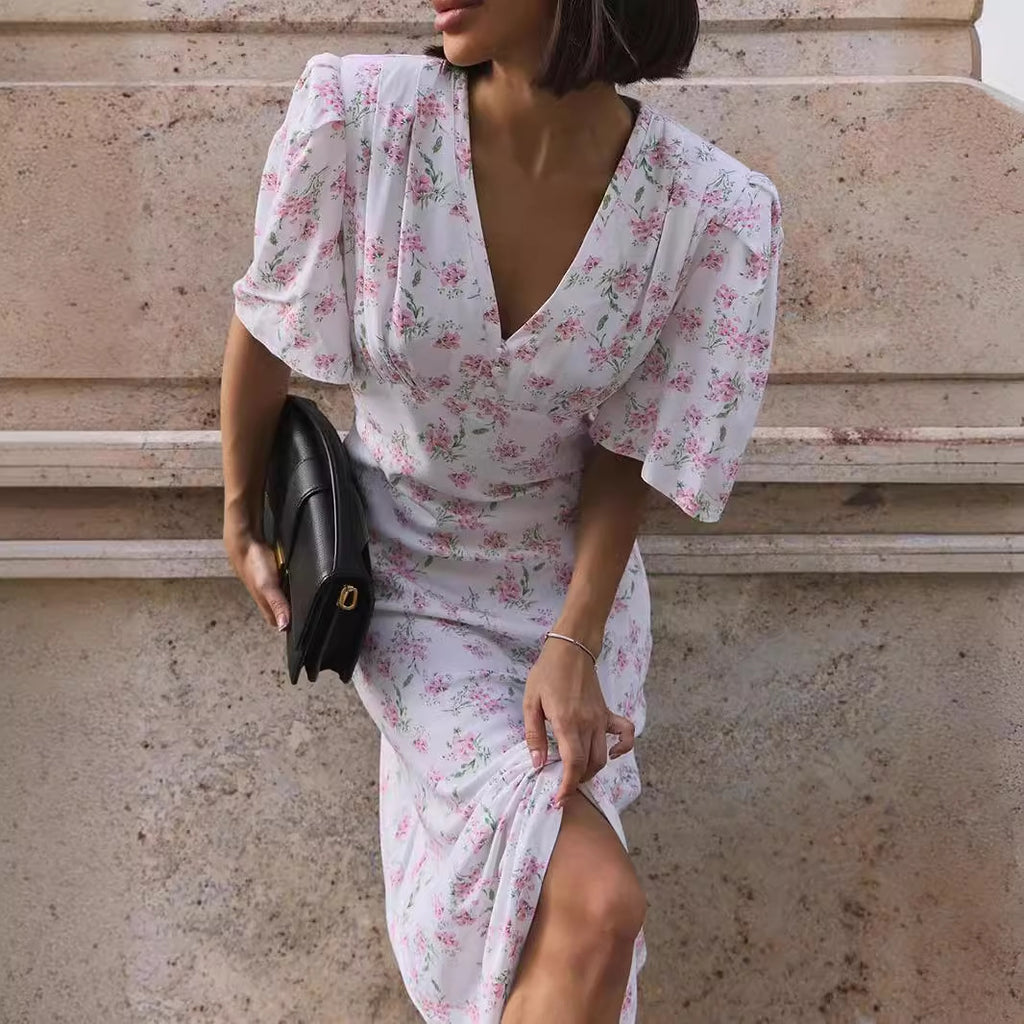 Floral Puff-Sleeve V-Neck Maxi Dress in White Floral — detail of slit and bodice on model