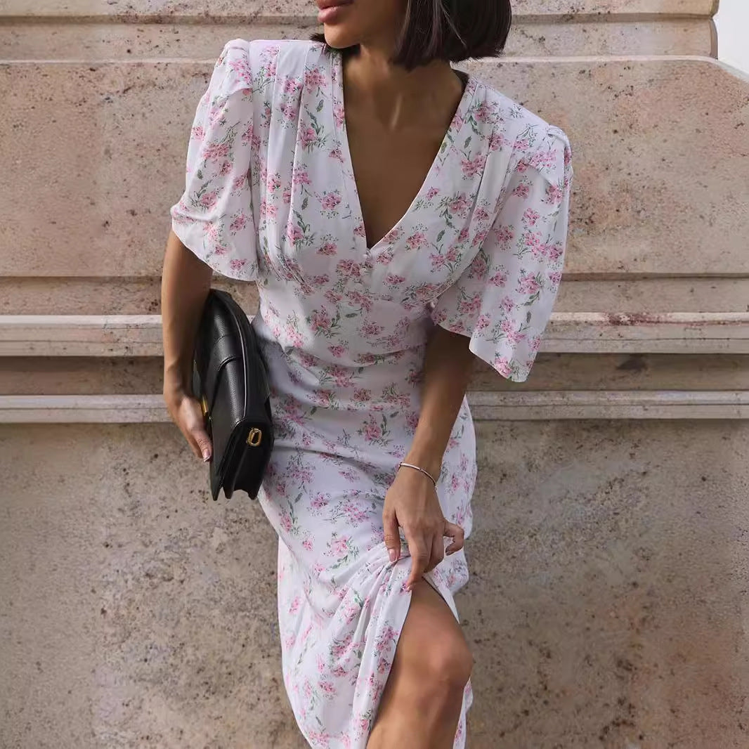Floral Puff-Sleeve V-Neck Maxi Dress in White Floral — detail of slit and bodice on model