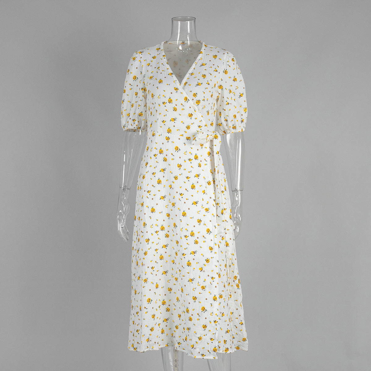 Cotton Floral Puff-Sleeve Wrap Midi Dress in Yellow Floral — front on mannequin