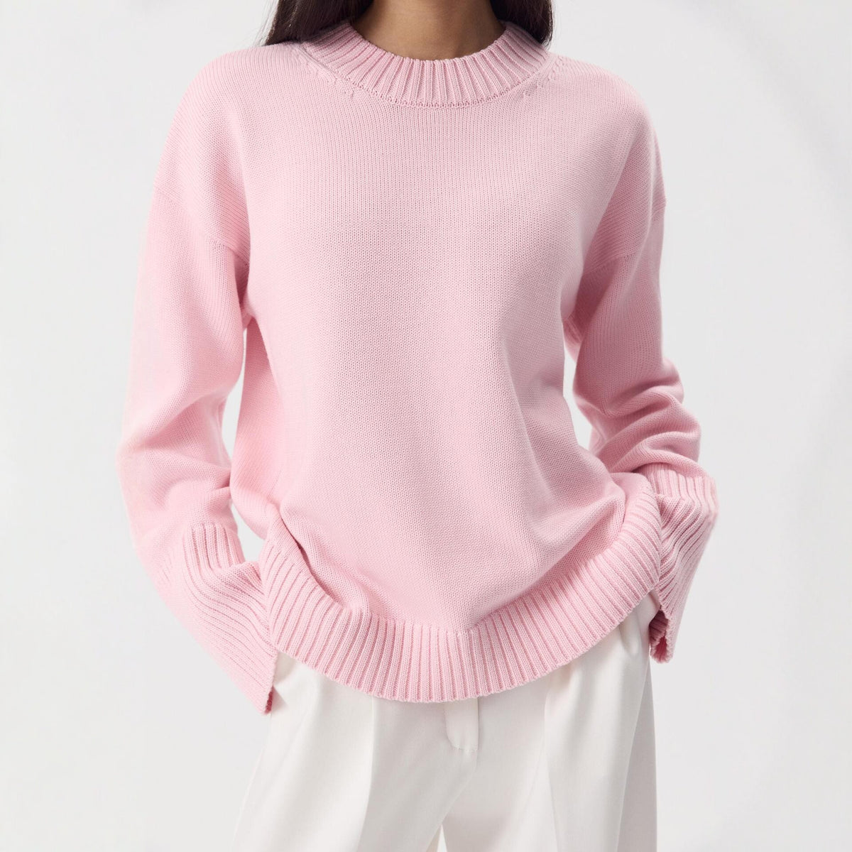 Relaxed Cotton Crew Neck Sweater with Ribbed Cuffs in Ballet Pink — front view on model