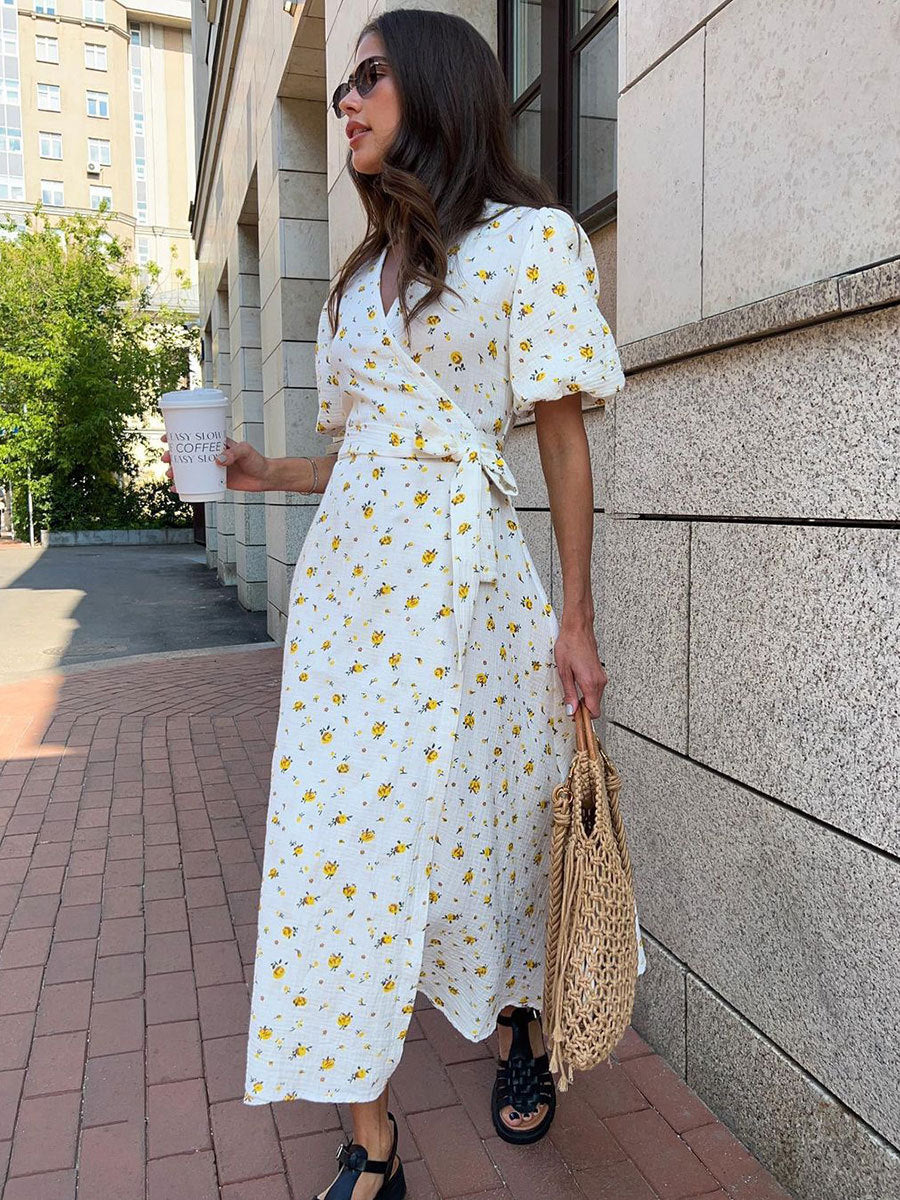 Cotton Floral Puff-Sleeve Wrap Midi Dress in Yellow Floral — back view on model