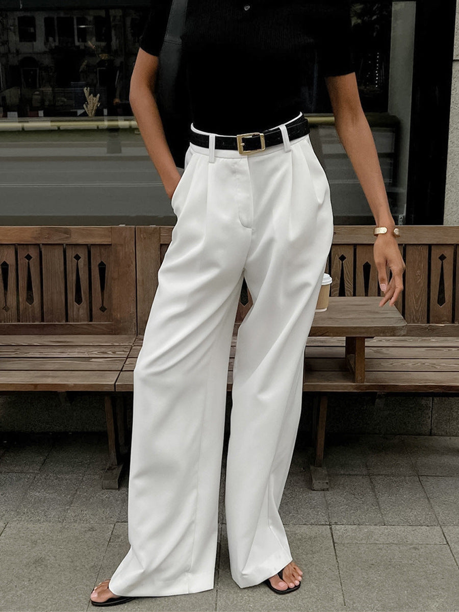 High-Waist Pleated Wide-Leg Trousers in White — on model
