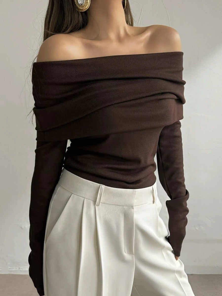 Off-Shoulder Fold-Over Knit Sweater in Chocolate Brown — front view with white trousers