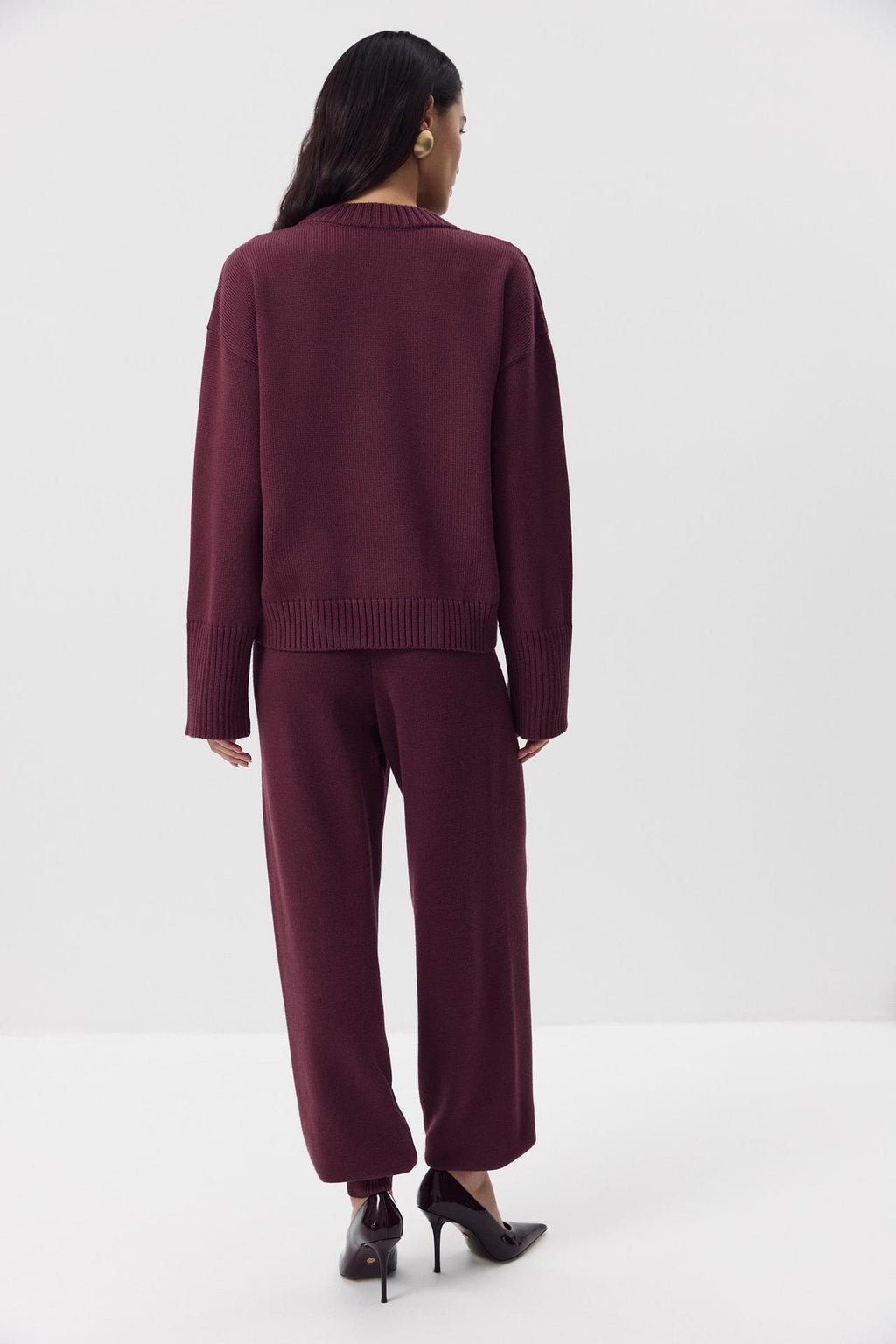 Relaxed Cotton Crew Neck Sweater with Ribbed Cuffs in Burgundy — back view on model