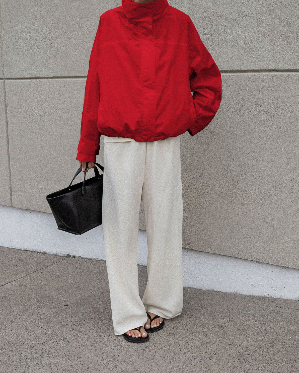 Oversized Stand-Collar Nylon Jacket with Drawcord Hem in Red — on model with wide-leg trousers