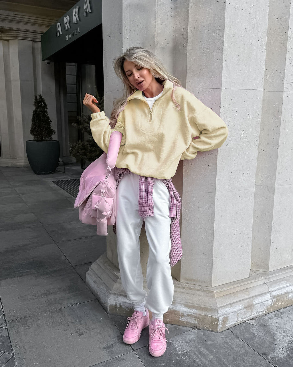 Relaxed Half-Zip Fleece Pullover with Elastic Hem in Butter Yellow — full-length view on model