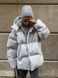 Matte Oversized Hooded Puffer Jacket in Light Gray — front view on model
