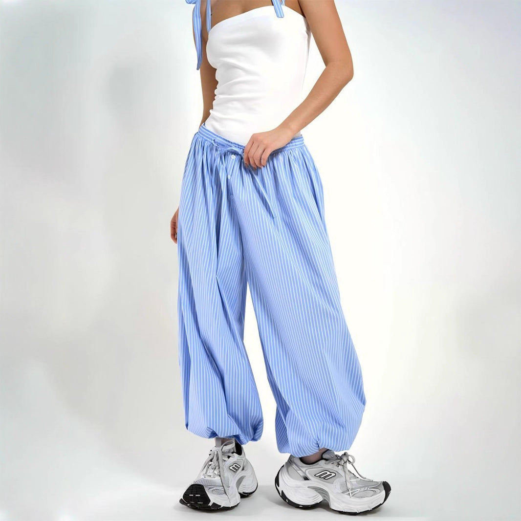 Striped Balloon Harem Pants in Blue Stripe — studio view with sneakers