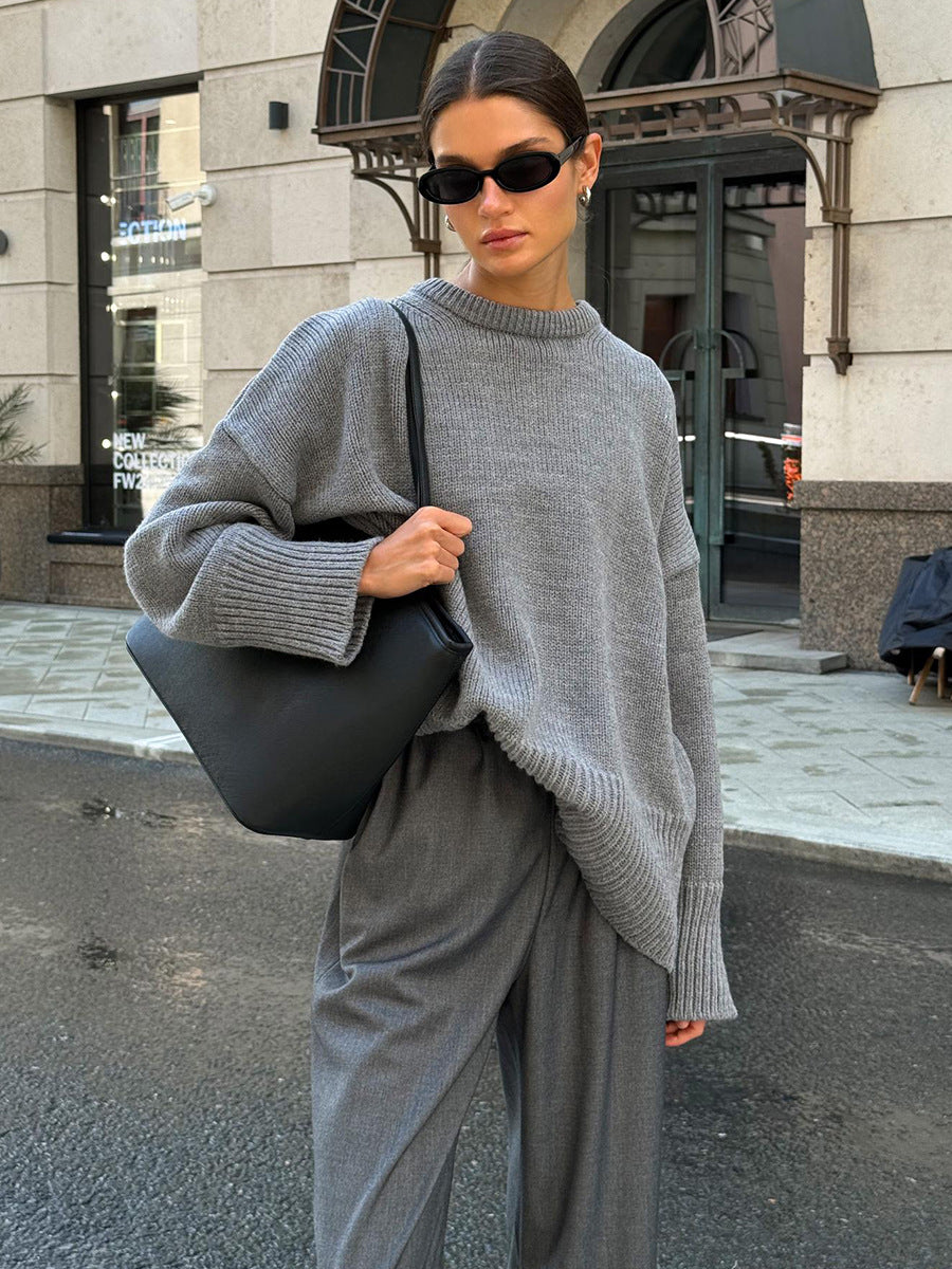 Slouchy Oversized Crew Neck Sweater in Heather Gray — front view on model with gray trousers