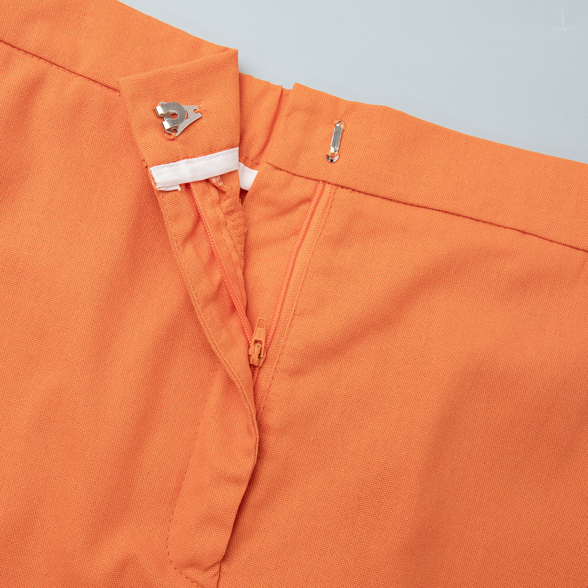 Linen Vest & Maxi Skirt Set in Orange — close-up of skirt zip and hook