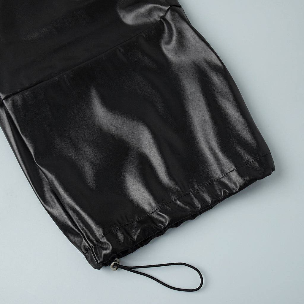 Faux Leather Balloon Pants with Drawstring Ankles in Black — close-up of ankle drawstring with toggle