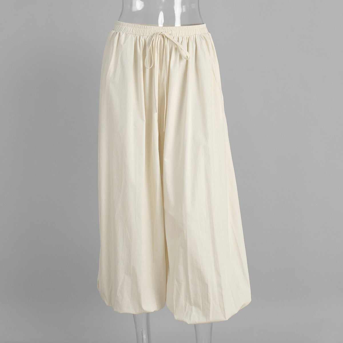 Cotton Balloon Lantern Pants in Apricot Cream — front view on mannequin